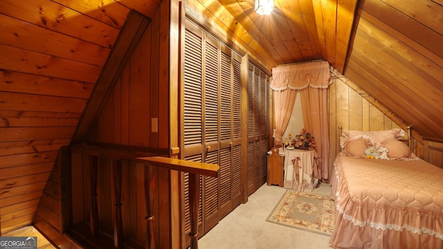 bedroom featuring wooden ceiling, vaulted ceiling, a closet, and wooden walls