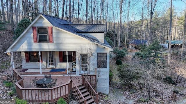 view of front of home featuring a wooden deck and a porch