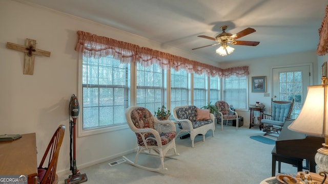 sunroom with ceiling fan and plenty of natural light