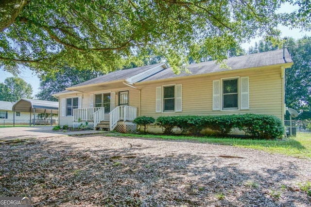 ranch-style house with a carport