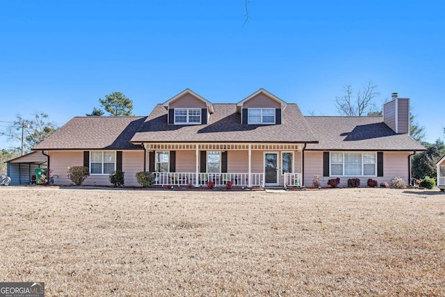 view of front of house with a porch and a front yard