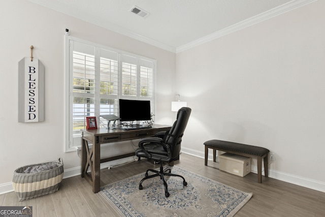 office area featuring ornamental molding and hardwood / wood-style flooring