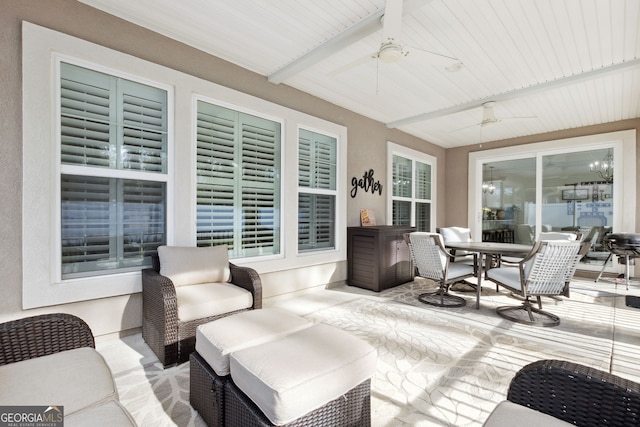 deck featuring ceiling fan and a patio