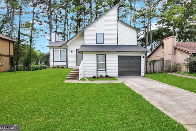 view of front of home with a garage and a front lawn