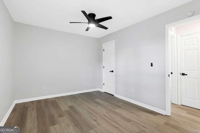 unfurnished bedroom featuring ceiling fan and wood-type flooring