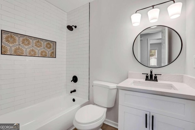 full bathroom featuring toilet, vanity, and tiled shower / bath combo