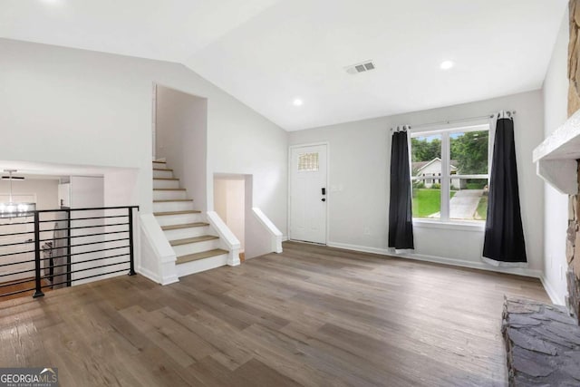 entrance foyer featuring vaulted ceiling and hardwood / wood-style flooring