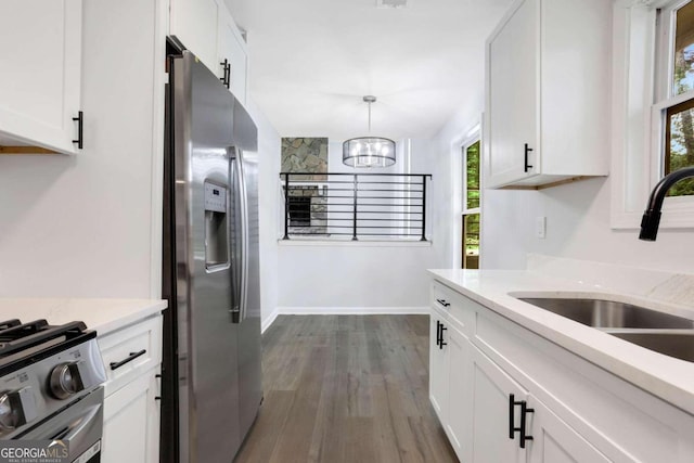 kitchen with sink, white cabinetry, and appliances with stainless steel finishes