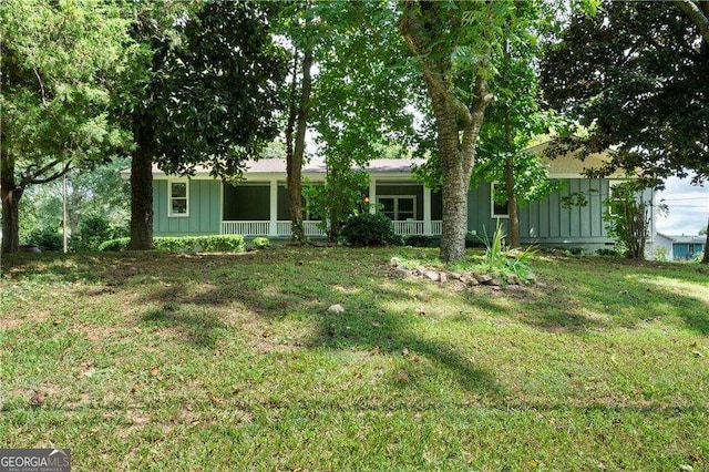 view of yard with covered porch