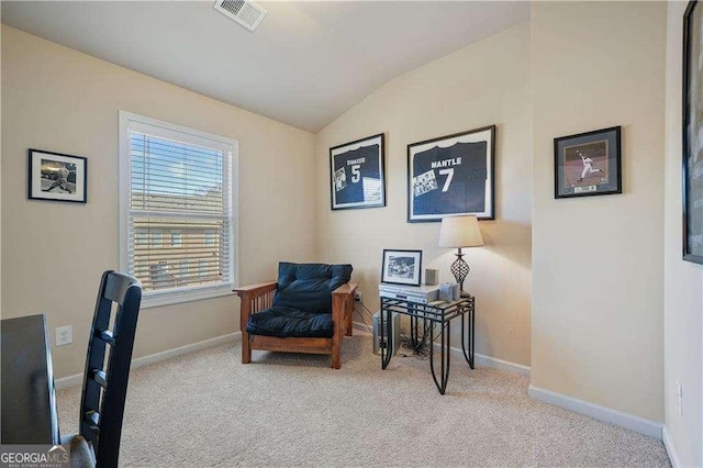 office area with light carpet and vaulted ceiling