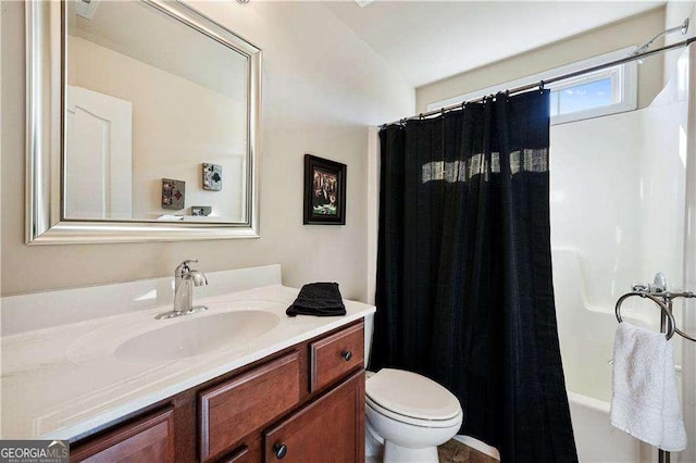 full bathroom featuring toilet, shower / bath combination with curtain, and vanity