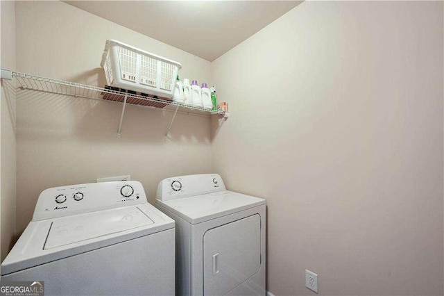 laundry area with washing machine and dryer