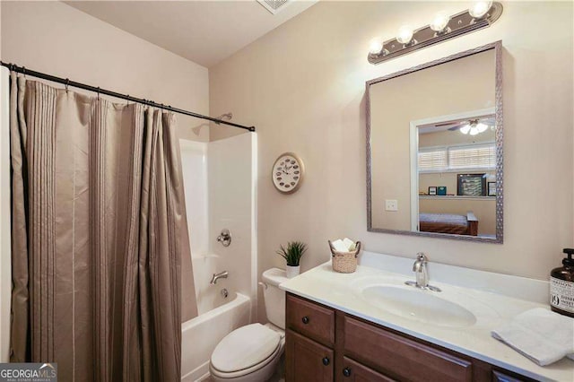 full bathroom with toilet, vanity, and shower / tub combo with curtain