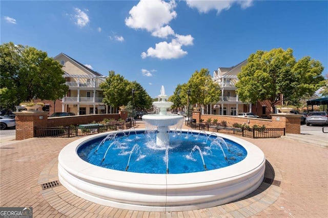 view of pool with pool water feature