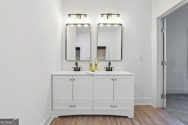 bathroom featuring wood-type flooring and vanity