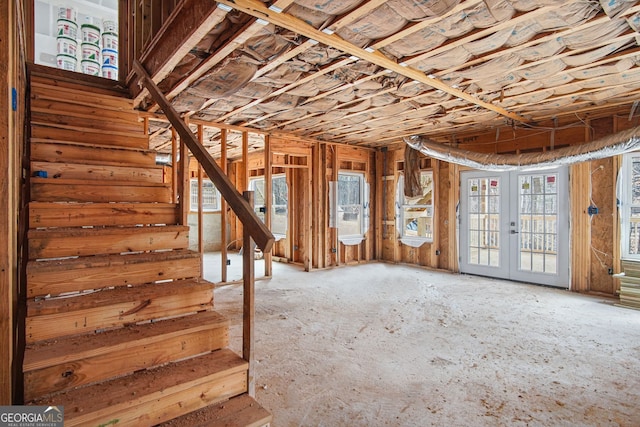 interior space with stairway and french doors