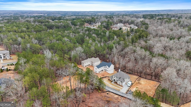 bird's eye view featuring a forest view