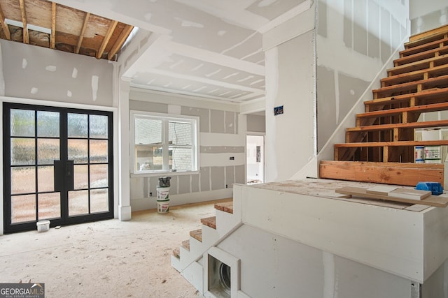 staircase with french doors