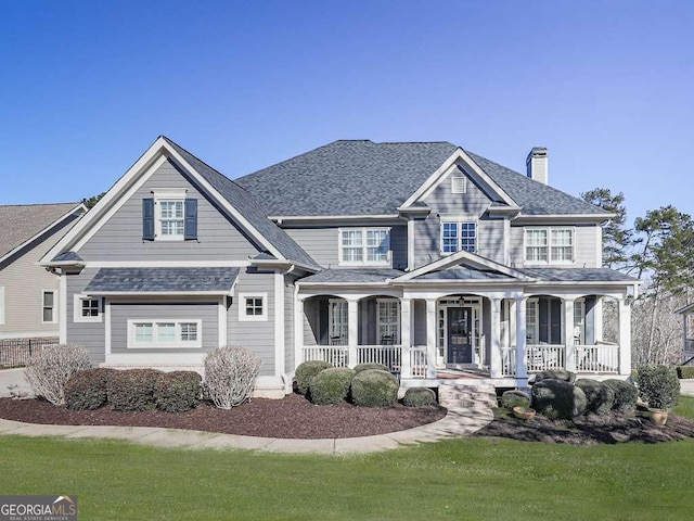 view of front of home with a front lawn and a porch