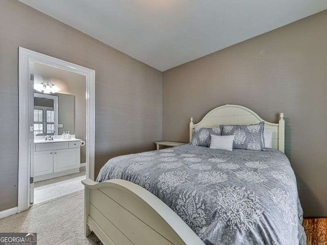 bedroom featuring carpet and ensuite bath