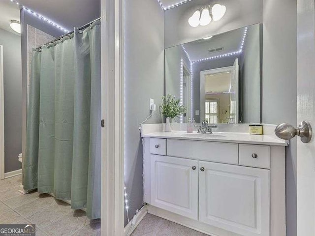 bathroom with baseboards and vanity