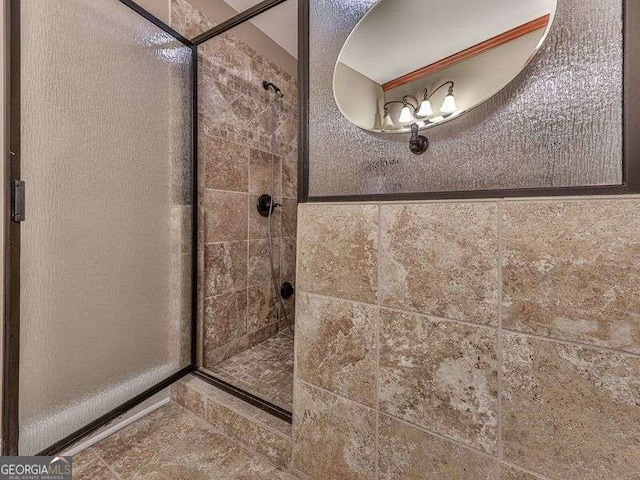 bathroom with tiled shower