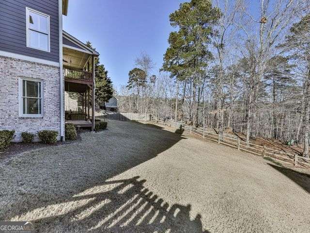 view of yard featuring a balcony