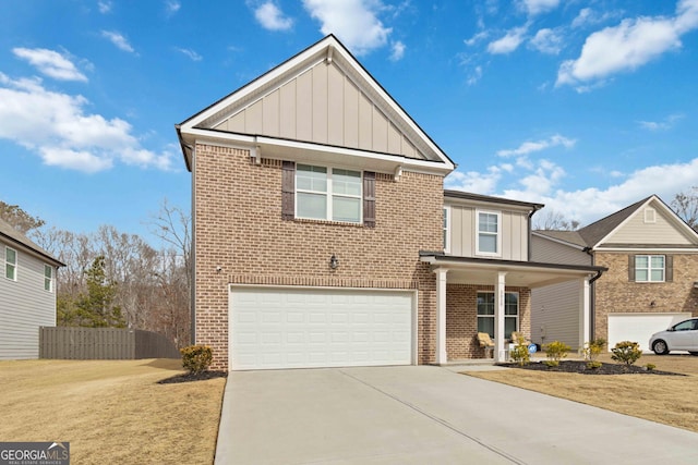 view of front property with a garage, a front yard, and a porch