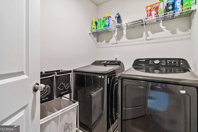 clothes washing area featuring washing machine and clothes dryer