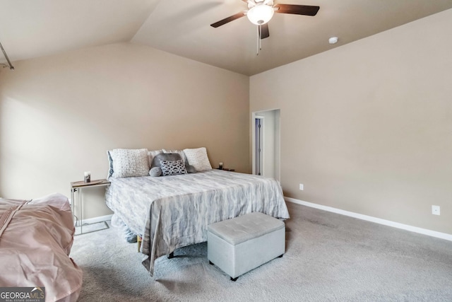 bedroom with lofted ceiling, ceiling fan, and carpet flooring