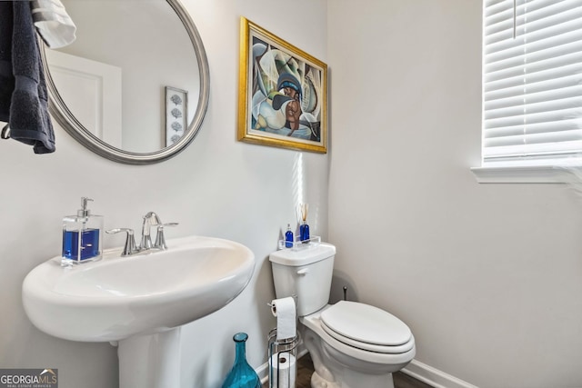 bathroom featuring sink and toilet