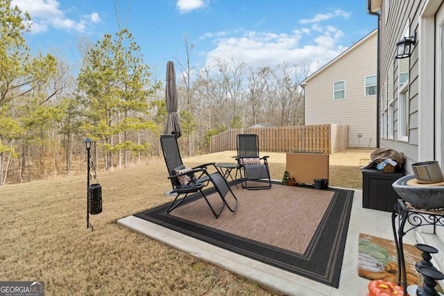 wooden terrace with a lawn