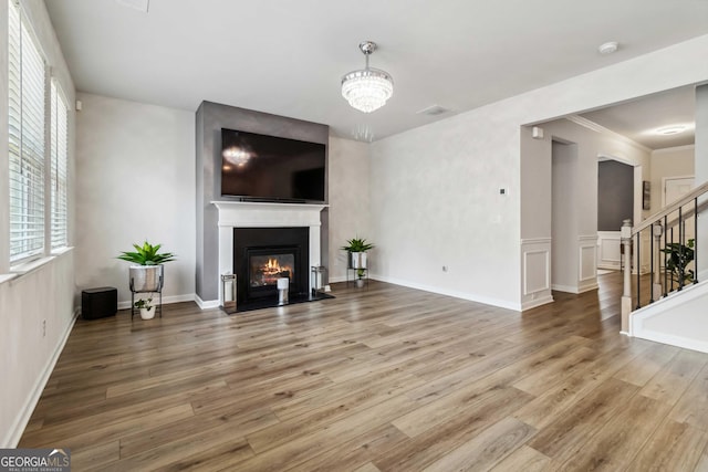 living room featuring an inviting chandelier and hardwood / wood-style floors