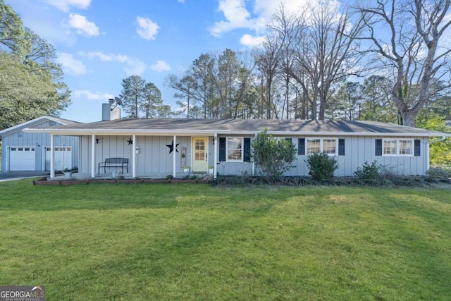 ranch-style home featuring a front lawn, a garage, and a porch