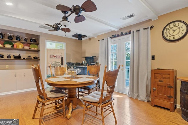 dining space with beam ceiling, french doors, ceiling fan, and light hardwood / wood-style floors