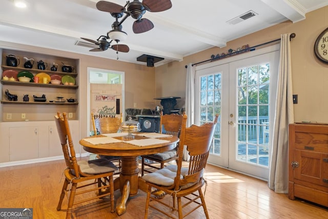 dining space with light hardwood / wood-style flooring, ceiling fan, beam ceiling, and french doors