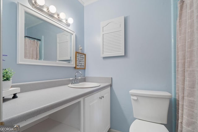 bathroom featuring toilet, crown molding, a shower with curtain, and vanity