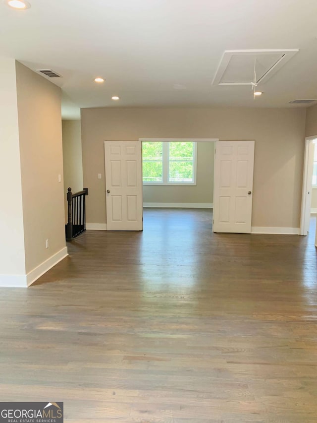 unfurnished room with hardwood / wood-style floors