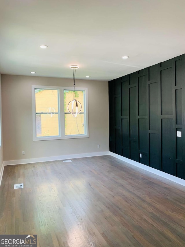 unfurnished room with light wood-type flooring