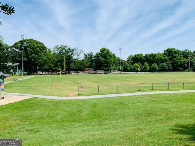 view of property's community with a yard