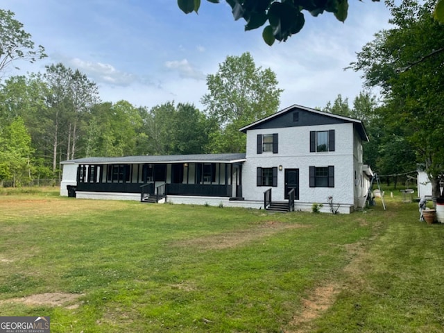 view of front of home with a front lawn