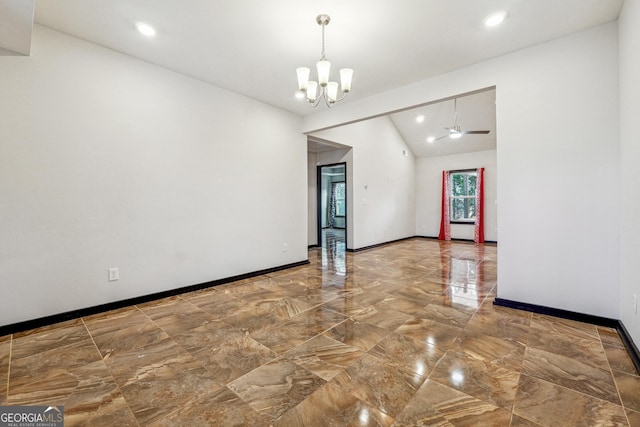 spare room with vaulted ceiling and ceiling fan with notable chandelier