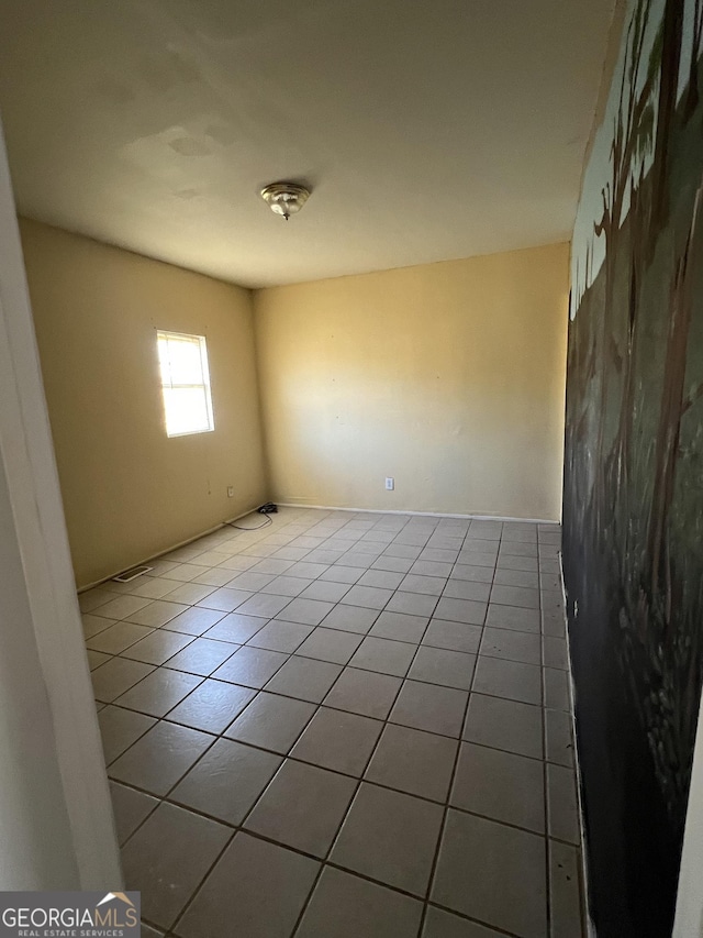 spare room featuring tile patterned floors