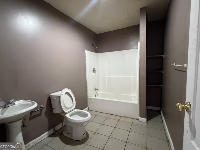 bathroom with toilet, bathtub / shower combination, and tile patterned floors