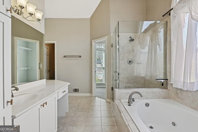 full bath featuring visible vents, a shower stall, vanity, a whirlpool tub, and a notable chandelier