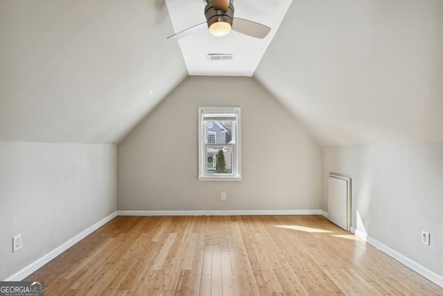 bonus room featuring a ceiling fan, visible vents, wood finished floors, and lofted ceiling
