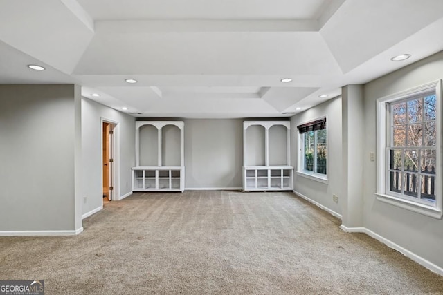carpeted spare room with recessed lighting, baseboards, and a tray ceiling
