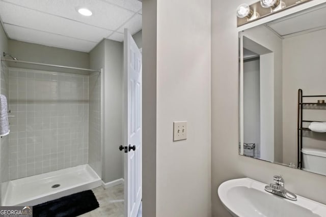 full bath featuring a sink and a shower stall