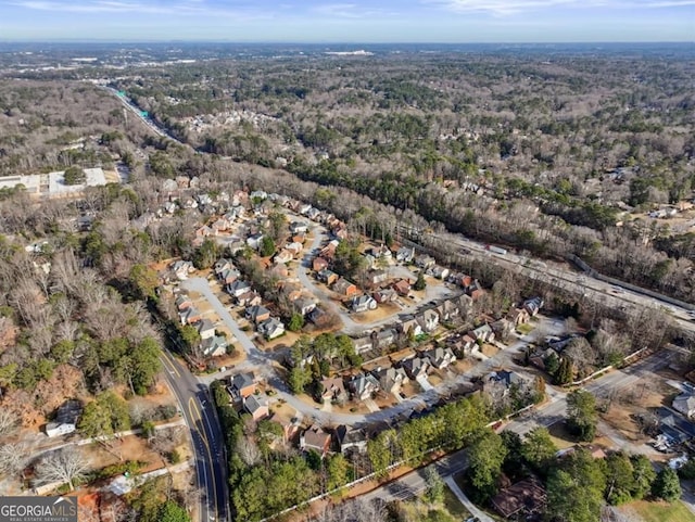 aerial view with a residential view and a wooded view