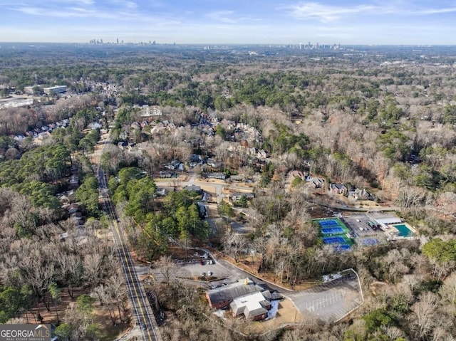 drone / aerial view featuring a view of trees